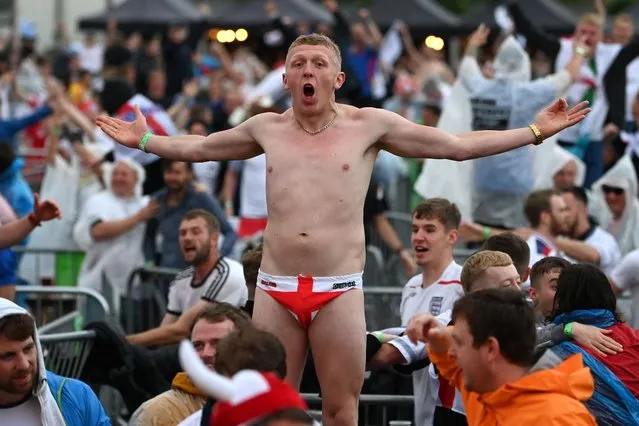England supporters react at the 4TheFans Fan Park in Manchester, north-west England on July 3, 2021, watching the UEFA EURO 2020 quarter-final football match between England and Ukraine being played in Rome. (Photo by Paul Ellis/AFP Photo)