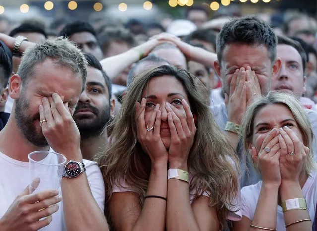 In this July 11, 2018 file photo England soccer fans react after Croatia scored their side's first goal as they watch a live broadcast on a big screen of the semifinal match between Croatia and England at the 2018 soccer World Cup, in Flat Iron Square, south London. (Photo by Luca Bruno/AP Photo/File)