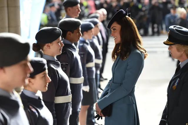 Britain's Kate, the Duchess of Cambridge, cente,  smiles as she meets members of the air cadets, after a service to mark the 75th anniversary year of the RAF Air Cadets, in London, Sunday, February 7, 2016. (Photo by Eddie Mulholland/Pool Photo via AP Photo)