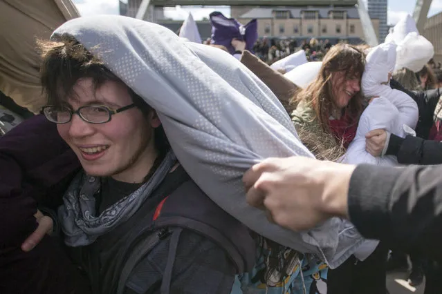 People participate in a pillow fight to mark International Pillow Fight Day, Saturday, April 4, 2015, in Toronto. (Photo by Chris Young/AP Photo/The Canadian Press)