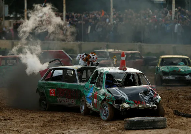 Drivers take part in a demolition derby organised by the Malta Motor Sports Association to raise funds for charity in Ta' Qali, outside Valletta, Malta, January 8, 2017. (Photo by Darrin Zammit Lupi/Reuters)