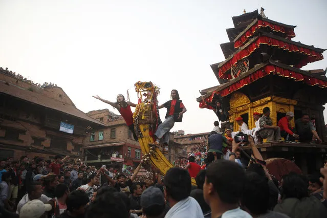 Nepalese devotees participate in Bisket Jatra Festival in Bhaktapur, Nepal, Friday, April 10, 2015. (Photo by Niranjan Shrestha/AP Photo)