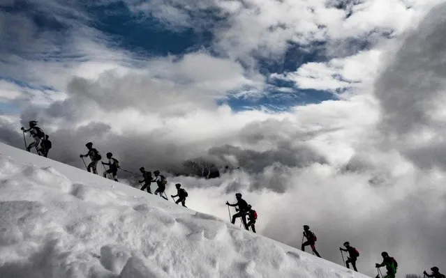 Skiers compete during the first stage of the 34th edition of the ski-mountaineering race Pierra-Menta, on March 13, 2019 in Areches-Beaufort, French Alps. (Photo by Jeff Pachoud/AFP Photo)