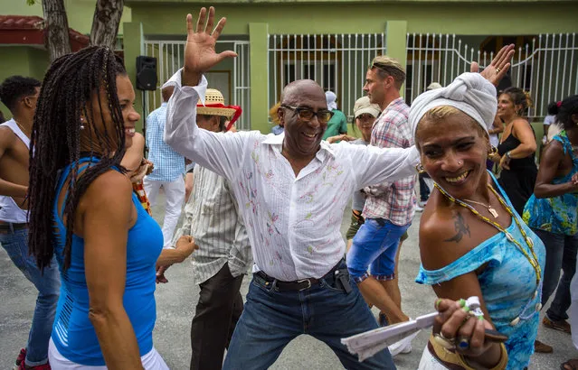 Cubans enjoy a weekly rumba dance gathering in Havana, Cuba, Saturday, March 19, 2016. (Photo by Desmond Boylan/AP Photo)