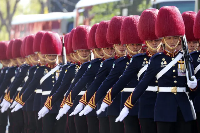 The royal guard walk into outside Grand Palace in Bangkok, Thailand, Saturday, May 4, 2019. After a more than a decade of political strife, including a military coup and a contentious election less than two months ago, the people of Thailand are witnessing this weekend the coronation of King Maha Vajiralongkorn in a centuries-old royal tradition that last happened seven decades ago. (Photo by Sakchai Lalit/AP photo)