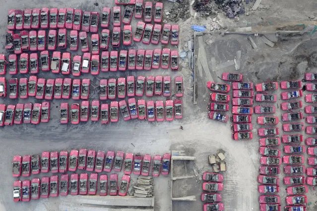 Scrapped taxis are seen in a parking lot in Taiyuan as the city is adapting to electric taxis, Taiyuan, Shanxi Province, China, March 15, 2016. (Photo by Jon Woo/Reuters)