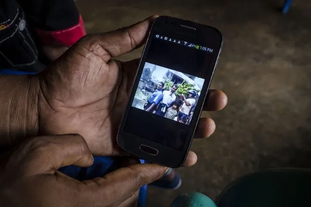 A Rohingya refugee  Muhammad Rofiq (37), shows video of his parents when their village was burned inside of their refugee camp on February 12, 2017 in Medan, North Sumatra, Indonesia. Muhammad Rofiq, have been in refugee camp for six years and are not able to legally work while waiting for registration and resettlement. (Photo by Ulet Ifansasti/Getty Images)