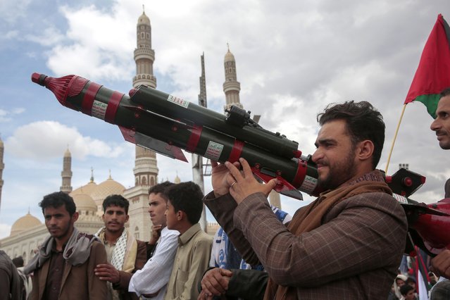 A Houthi supporter holds a mock missile during a protest marking Jerusalem Day in support of Palestinians in the Gaza Strip, in Sanaa, Yemen, Friday, April 5, 2024. (Photo by Osamah Abdulrahman/AP Photo)