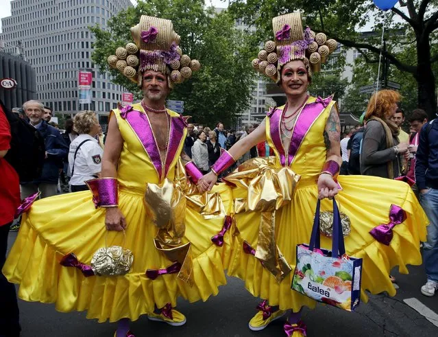 People participate in colourful costumes at the annual Christopher Street Day parade on Kurfuerstendamm in Berlin, Germany, June 27, 2015. (Photo by Fabrizio Bensch/Reuters)