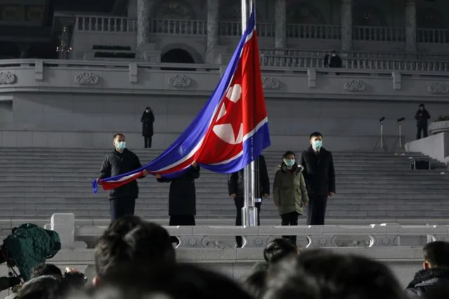 National flag hoisting ceremony is held on Kim Il Sung Square in Pyongyang, North Korea, on New Year's Day Saturday, January 1, 2022. (Photo by Cha Song Ho/AP Photo)