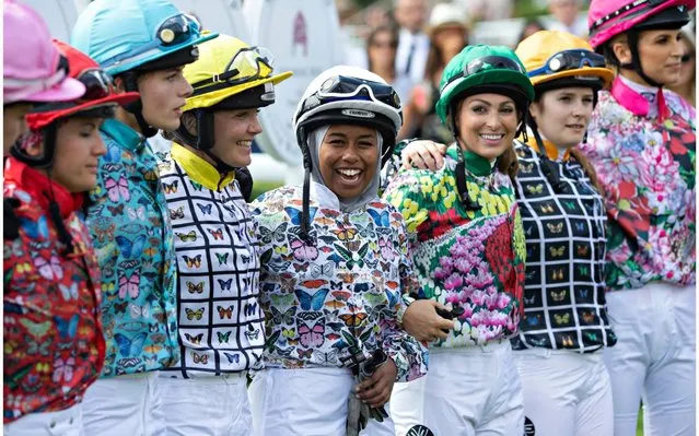 Khadijah Mellah (C) celebrates with her fellow jockeys after winning the “Magnolia Cup” charity ladies race on “Ladies Day” of the Qatar Goodwood Festival 2019 at Goodwood Racecourse on August 1, 2019 in Chichester, England. Khadijah, from Peckham, London who only sat on a racehorse for the first time in April is the first British Muslim female jockey to wear a hijab whilst racing. (Photo by Rupert Hartley/Indigo/Getty Images)