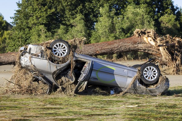 A car lies upside down in a paddock following Cyclone Gabrielle, in the Hawkes Bay, New Zealand, Saturday, February 18, 2023. Cyclone Gabrielle struck the country's north on Feb. 13 and the level of damage has been compared to Cyclone Bola in 1988. That storm was the most destructive on record to hit the nation of 5 million people. (Photo by Mike Scott/NZ Herald via AP Photo)