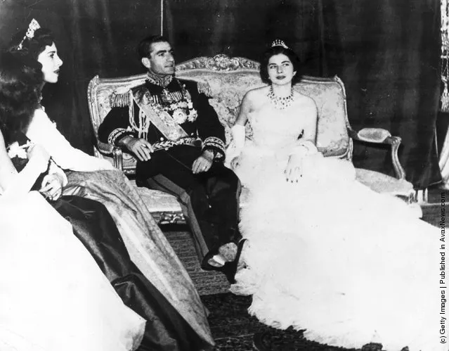 1951: Muhammad Reza Pahlavi, the Shah of Iran (1919 - 1980) with his second wife Princess Soraya Esfandiary Bakhtiari after their wedding ceremony. His sisters who acted as bridesmaids are on the left. The marriage was dissolved in 1958