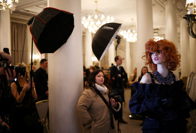 A model prepares backstage ahead of the Paul Costelloe catwalk show during London Fashion Week, in London, Britain on February 17, 2023. (Photo by Henry Nicholls/Reuters)