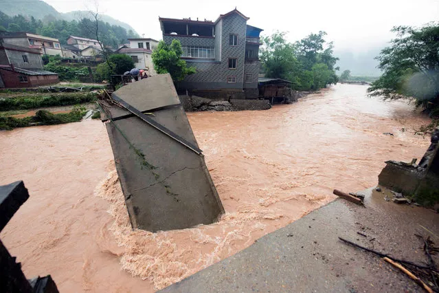 A bridge damaged by flood is pictured in Guilin, Guangxi Zhuang Autonomous Region, China, May 8, 2016. (Photo by Reuters/Stringer)