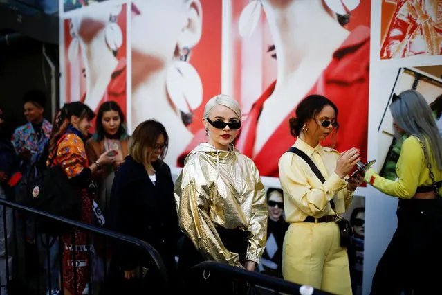 People line up outside a venue at London Fashion Week in London, Britain, September 17, 2019. (Photo by Henry Nicholls/Reuters)
