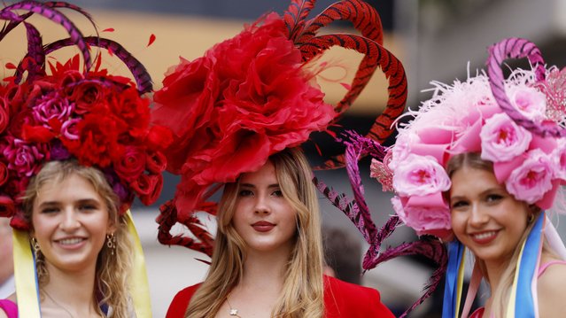 Racegoers pose for a picture ahead of the races  during the Royal Ascot in Ascot, Britain, June 18, 2024. (Photo by Andrew Couldridge/Action Images via Reuters)