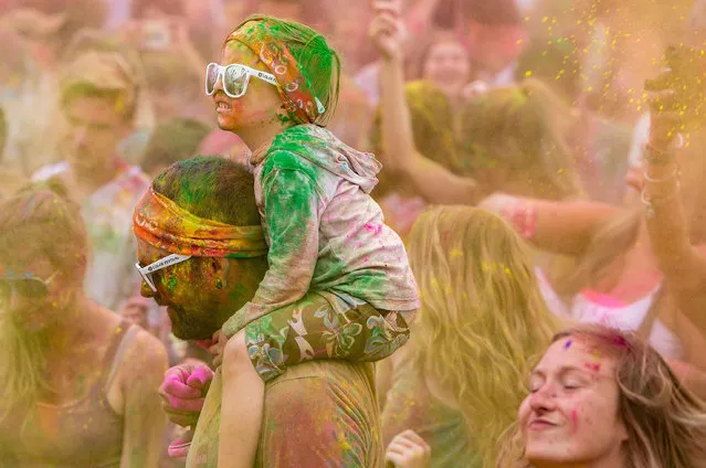 People of all ages attend the Hindu celebration of Holi Hai, or Festival of Colors at Oceanside Pier Amphitheatre on May 14, 2016 in Oceanside, California. (Photo by Daniel Knighton/Getty Images)
