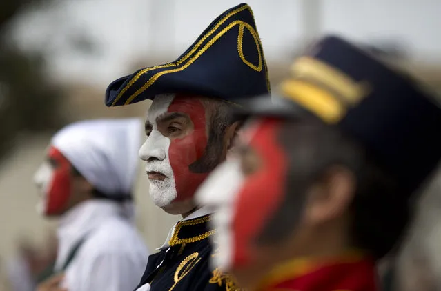 A patient from the Larco Herrera Psychiatric Hospital wears a costumes in the likeness of Peru's Independence hero Don Jose de San Martin during the hospital's Independence Day parade in Lima, Peru, Wednesday, July 22, 2015. (Photo by Martin Mejia/AP Photo)