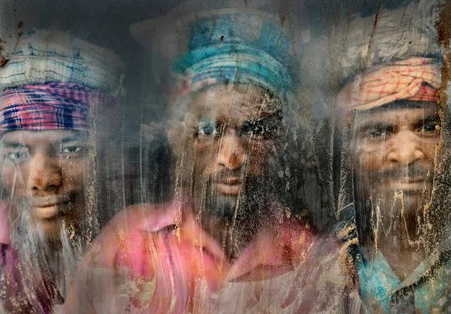 Gravel Workmen of Chittagong, Bangladesh, by Faisal Azim. Gravel workmen look through a glass window at a gravel-crushing yard in Chittagong. Full of dust and sand, it is an extremely unhealthy environment for working, but still hundreds of people work here for their livelihoods. (Photo by Faisal Azim/2016 Atkins CIWEM Environmental Photographer of the Year)