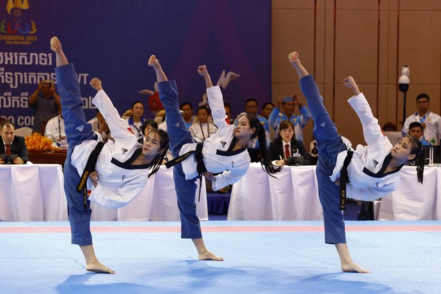 Vietnam's Thi Hong Trang Nguyen, Thi Kim Ha Nguyen and Tran Kim Uyen Le during the women's recognized poomsae team final at Chroy Changvar Convention Centre Hall F in Phnom Penh, Cambodia on May 12, 2023. (Photo by Kim Kyung-Hoon/Reuters)