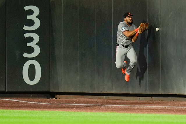 Baltimore Orioles outfielder Anthony Santander tries to catch a foul ball during the fourth inning of a baseball game against the New York Mets at Citi Field, Monday, August 19, 2024, in New York. (Photo by Seth Wenig/AP Photo)