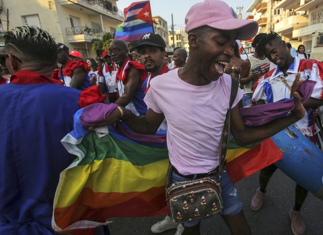 A member of the LGBTQ community dances during a gay pride march in support of the fight for tolerance and acceptance, in Havana, Cuba, May 11, 2024. (Photo by Ariel Ley/AP Photo)