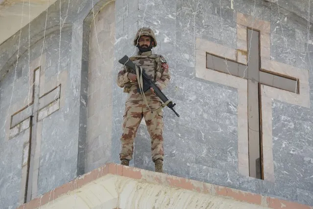 A Frontier Constabulary (FC) personnel stands guard during an Easter Sunday mass at the Bethel Memorial Methodist Church in Quetta on April 17, 2022. (Photo by Banaras Khan/AFP Photo)