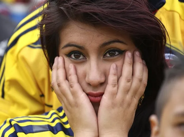 A Colombia fan reacts after Brazil scores a goal during the 2014 World Cup quarter-finals between Brazil and Colombia, during a screening at Bolivar Square in Bogota July 4, 2014. (Photo by John Vizcaino/Reuters)