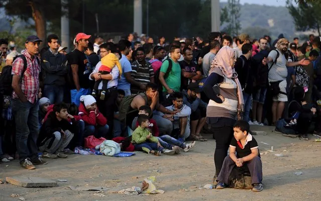 A new group of more than a thousand immigrants wait at the border line of Macedonia and Greece to enter into Macedonia near Gevgelija railway station August 20, 2015. (Photo by Ognen Teofilovski/Reuters)