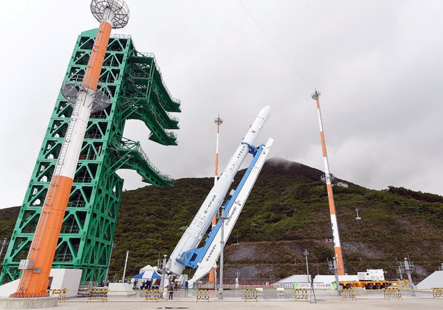 A handout photo made available by the Korea Aerospace Research Institute (KARI) shows South Korea's second homegrown space rocket, called Nuri, raised up to launch in the Naro Space Center in Goheung, South Jeolla Province, South Korea, 15 June 2022, South Korea will launch Nuri on 16 June 2022. (Photo by Korea Aerospace Research Institute (KARI)/EPA/EFE)