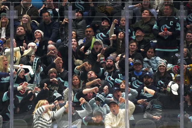 Seattle Kraken fans react after a goal by center Matty Beniers against the San Jose Sharks was disallowed due to goaltender interference during the third period of an NHL hockey game Saturday, November 30, 2024, in Seattle. The Sharks won 4-2. (Photo by Lindsey Wasson/AP Photo)