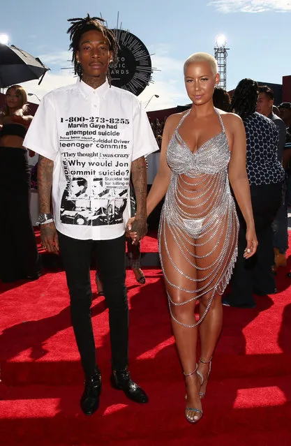 Rapper Wiz Khalifa (L) and model Amber Rose attend the 2014 MTV Video Music Awards at The Forum on August 24, 2014 in Inglewood, California. (Photo by Christopher Polk/Getty Images for MTV)