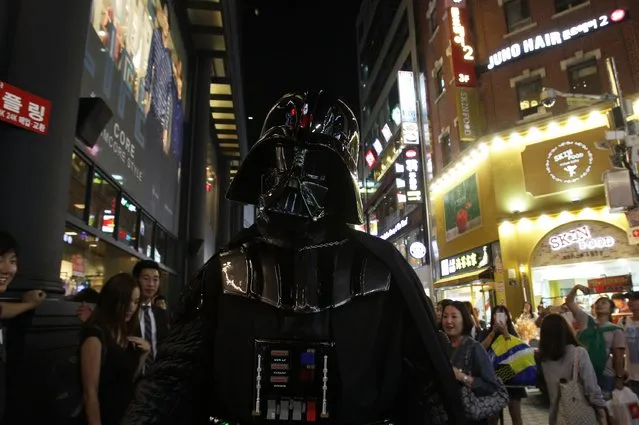 A South Korean man dressed in a Darth Vader during the “Star Wars – Force Friday” in Myeongdong shopping district on September 4, 2015 in Seoul, South Korea. Darth Vader and Stormtroopers made appearance at the global launch event “Star Wars – Force Friday” that Disney planned to debut the toys inspired by the upcoming film, “Star Wars: The Force Awakens”. (Photo by Chung Sung-Jun/Getty Images)