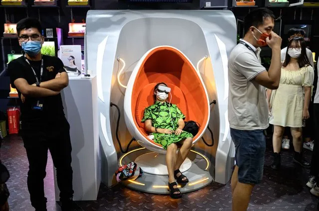 A visitor experiences VR during the Taobao Creation Festival on August 30, 2022 in Guangzhou, Guangdong Province of China.During the festival, well-known online stores will be gathered in the offline market, so that the audience can experience the products full of future technology. (Photo by Stringer/Anadolu Agency via Getty Images)