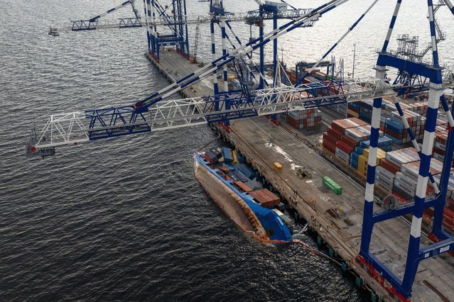 An aerial view of dry cargo ship lying on its side during loading at Ambarli Port, on December 23, 2024 in Istanbul, Turkiye. 15 personnel were evacuated from the ship. (Photo by Hakan Akgun/Anadolu via Getty Images)