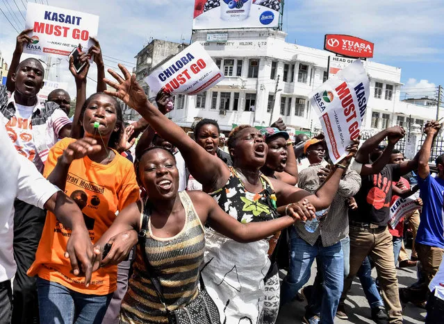 Opposition supporters protest and call for the resignation of Independent Electoral and Boundaries Commission (IEBC) officials over claims of bungling the August presidential vote, which was nullified by the Supreme Court, in Mombasa, Kenya, on October 6, 2017. Kenya' s opposition National Super Alliance (NASA) coalition calls to hold countrywide protests twice per week demanding the removal of the electoral body CEO Ezra Chiloba before the presidential repeat polls scheduled for October 26. (Photo by Andrew Kasuku/AFP Photo)