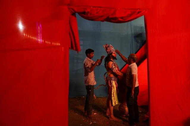 Actors get ready before a play based on the life of Hindu Lord Ram during Navratri festival celebrations, in the old quarters of Delhi, India on October 4, 2022. (Photo by Anushree Fadnavis/Reuters)