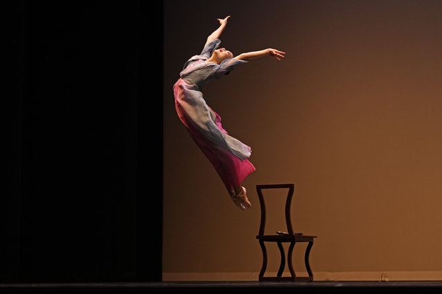 Hailey Zhao leaps from a chair during a ballet performance at the Youth America Grand Prix, Friday, January 17, 2025, at the Hanover Theater in Worcester, Mass. (Photo by Robert F. Bukaty/AP Photo)