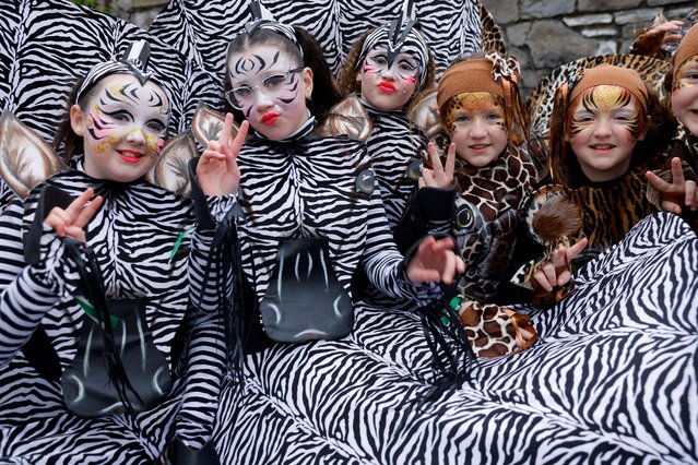 Revellers dressed in costumes pose for pictures ahead of the St. Patrick's Day parade in Dublin, Ireland on March 17, 2025. (Photo by Clodagh Kilcoyne/Reuters)
