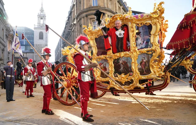The new Lord Mayor of London Nicholas Lyons waves from the Lord Mayor's State Coach outside Mansion House during the Lord Mayor's Show in the City of London on Saturday, November 12, 2022. (Photo by Jonathan Brady/PA Wire)