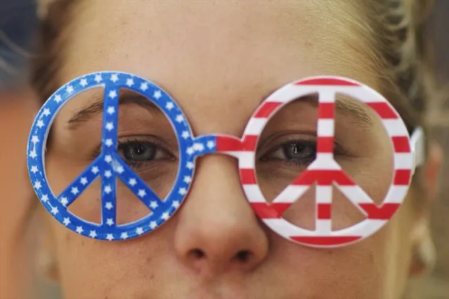 Carolyn Finnegan, 21, wears glasses with peace signs in the colors of the U.S. flag at the fourth annual Made in America Music Festival in Philadelphia, Pennsylvania, September 6, 2015. (Photo by Mark Makela/Reuters)