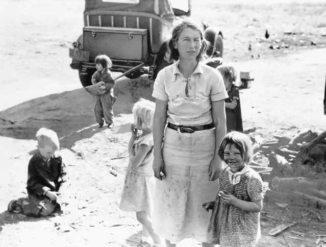 An unidentified mother of five children from Oklahoma is shown on May 18, 1937 in California near Fresno where they now live as migratory farm workers as a result of the Dust Bowl. (Photo by AP Photo)