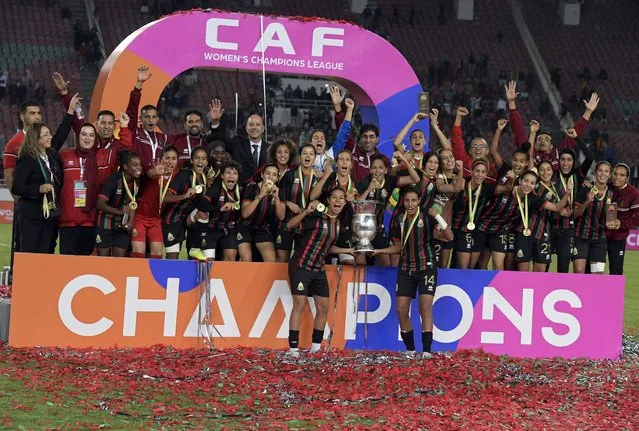 Rabat players celebrate with the trophy after winning the CAF Women's Champions League final between FAR Rabat and Mamelodi Sundowns in Rabat, Morocco, 13 November 2022. (Photo by Jalal Morchidi/EPA/EFE)