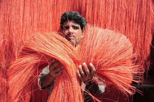A worker prepares vermicelli, used in the production of seviyan (vermicelli pudding), a popular dessert, especially during the holy month of Ramadan, at a workshop in Hyderabad, Pakistan, 11 March 2025. (Photo by Nadeem Khawer/EPA/EFE)