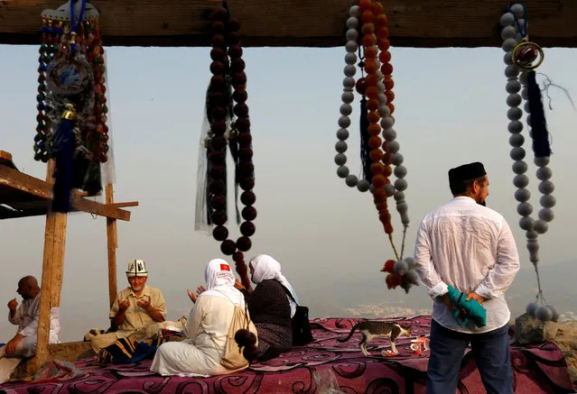 Pilgrims pray at Mount Al-Noor, where Muslims believe Prophet Mohammad received the first words of the Koran through Gabriel in the Hera cave, ahead of the annual haj pilgrimage in the holy city of Mecca, Saudi Arabia September 7, 2016. (Photo by Ahmed Jadallah/Reuters)