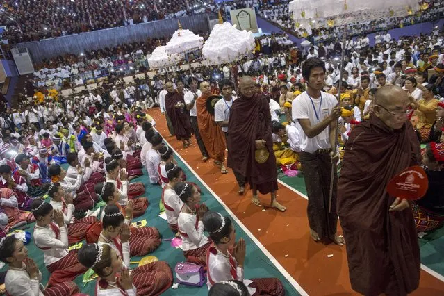 Leaders of radical Buddhist group Ma Ba Tha arrive during a celebration of the recent establishment of four controversial bills decried by rights groups as aimed at discriminating against the country's Muslim minority, at a rally in a stadium at Yangon October 4, 2015. (Photo by Soe Zeya Tun/Reuters)