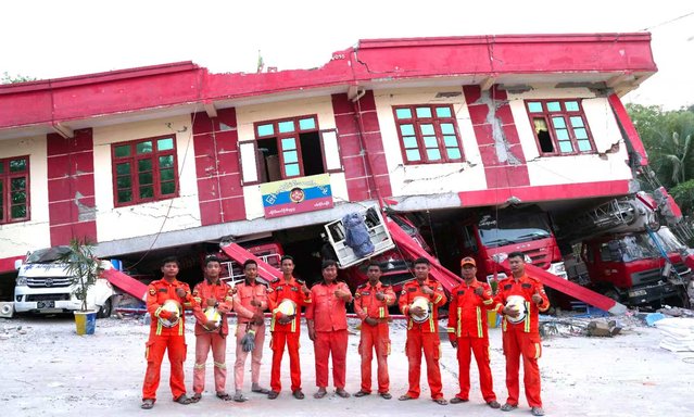 Firefighters pose for a photo in front of collapsed buildings of a fire station on April 4, 2025 in Sagaing, Myanmar. Efforts are continuing to search for survivors of last Friday's powerful earthquake in Myanmar, as other post-disaster work proceeds in some parts of the city at the same time to clear the rubble of collapsed buildings, provide medical care for the injured and proper shelter for the affected, and prevent the spread of potential diseases. (Photo by Chengdu Economic Daily/VCG via Getty Images)