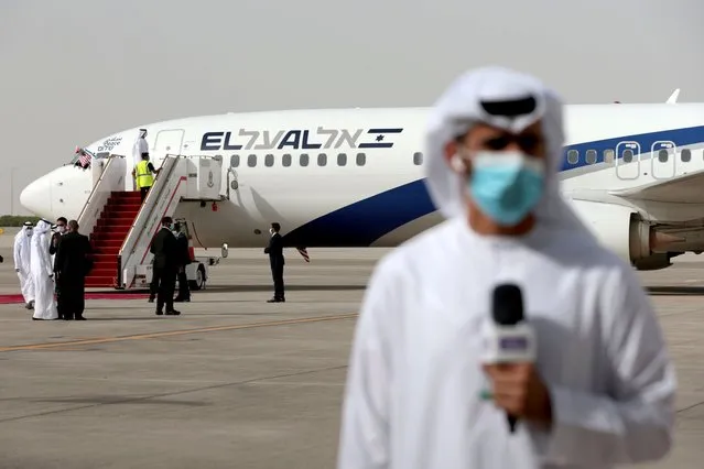 A member of the media reports after the Israeli flag carrier El Al's airliner carrying Israeli and U.S. delegates landed at Abu Dhabi International Airport, in Abu Dhabi, United Arab Emirates on August 31, 2020. (Photo by Christopher Pike/Reuters)