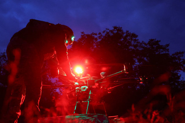 Policemen of the 'Khyzhak' Brigade prepare a Vampire combat drone for a delivery of ammunition and food for their brothers-in-arms to a position near a frontline town of Toretsk in Donetsk region Ukraine on May 30, 2025. (Photo by Anatolii Stepanov/Reuters)
